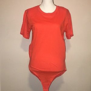 Free People orange bodysuit T shirt w/side bands